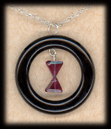 La Veuve Noire garnet and onyx hourglass pendant